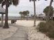 Sandy beach path with ocean and houses at 12904 College Hill Dr, Hudson, FL 34667