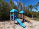 playground with a slide, climbing structures, and shaded areas at 2741 Via Cipriani # 931A, Clearwater, FL 33764