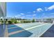 Well-maintained shuffleboard courts with covered seating areas at 37608 Lorena Ave, Zephyrhills, FL 33541
