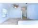 Bright dining area with ceiling fan and access to hallway at 37608 Lorena Ave, Zephyrhills, FL 33541