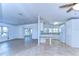 Open concept kitchen and living area with light colored cabinetry at 37608 Lorena Ave, Zephyrhills, FL 33541