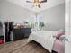 Well-lit bedroom featuring a dresser and large window at 14173 Pullman Dr, Spring Hill, FL 34609