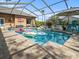 Refreshing swimming pool with inflatable toys and screened enclosure at 14173 Pullman Dr, Spring Hill, FL 34609
