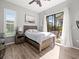 Bedroom with sliding glass doors leading to the backyard at 14173 Pullman Dr, Spring Hill, FL 34609