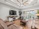 Living room featuring herringbone floors and sliding glass doors at 14173 Pullman Dr, Spring Hill, FL 34609