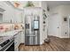 Stainless steel refrigerator in a spacious kitchen with granite countertops at 14173 Pullman Dr, Spring Hill, FL 34609