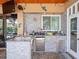 Outdoor kitchen with granite countertops and stainless steel appliances at 14173 Pullman Dr, Spring Hill, FL 34609