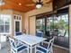 Covered patio with outdoor dining set and pool view at 14173 Pullman Dr, Spring Hill, FL 34609