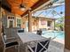 Covered patio with outdoor dining set and pool view at 14173 Pullman Dr, Spring Hill, FL 34609