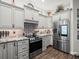 Open concept kitchen with large island and stainless steel appliances at 14173 Pullman Dr, Spring Hill, FL 34609