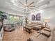 Relaxing living room with herringbone floors and large art piece at 14173 Pullman Dr, Spring Hill, FL 34609