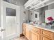 Bathroom with double sink vanity and wood cabinets at 14173 Pullman Dr, Spring Hill, FL 34609