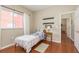 Charming bedroom with wood floors, twin bed, and access to hallway at 12923 Carlington Ln, Riverview, FL 33579