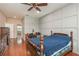 Spacious bedroom with wood flooring and built-in shelving at 12923 Carlington Ln, Riverview, FL 33579