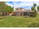 Large backyard with spacious lawn, screened patio, and gazebo at 12923 Carlington Ln, Riverview, FL 33579