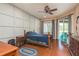 Bedroom with wood flooring, a double bed and access to the backyard at 12923 Carlington Ln, Riverview, FL 33579