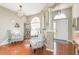 Spacious living room with hardwood floors and two armchairs at 12923 Carlington Ln, Riverview, FL 33579