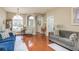 Open living area with hardwood floors and comfortable seating at 12923 Carlington Ln, Riverview, FL 33579