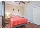 Relaxing bedroom with a queen bed and wood floors at 12923 Carlington Ln, Riverview, FL 33579
