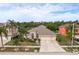 Two-story house with three car garage and lush landscaping at 12923 Carlington Ln, Riverview, FL 33579