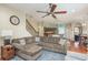 Open living space with large sectional sofa and kitchen views at 12923 Carlington Ln, Riverview, FL 33579