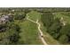 Aerial view of a golf course with a golf cart on the fairway at 12923 Carlington Ln, Riverview, FL 33579