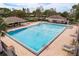 Inviting community pool with ample deck space and lounge chairs at 12923 Carlington Ln, Riverview, FL 33579
