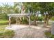 Relaxing patio with pergola and brick pavers at 12923 Carlington Ln, Riverview, FL 33579