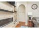 Stone fireplace with built-in shelves, creating a cozy ambiance at 12923 Carlington Ln, Riverview, FL 33579
