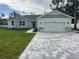 One-story home with attached two-car garage and paver driveway at 37570 Teri Ct, Dade City, FL 33525