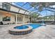 Resort-style pool and spa with covered patio and outdoor kitchen at 4114 W Zelar St, Tampa, FL 33629