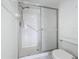 Bathroom with a white tiled walk-in shower and a toilet with a white seat at 4410 Fairways Blvd Blvd # 607, Bradenton, FL 34209
