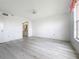 Spacious bedroom with light wood floors, window, ceiling fan, and an en suite bathroom at 4410 Fairways Blvd Blvd # 607, Bradenton, FL 34209