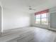 Bright bedroom featuring light wood flooring and a large window at 4410 Fairways Blvd Blvd # 607, Bradenton, FL 34209