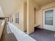 Exterior building walkway featuring exterior door, bench, and corridor with windows at 4410 Fairways Blvd Blvd # 607, Bradenton, FL 34209