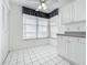 Eat-in kitchen area with tiled floor and white cabinets, bright and inviting at 4410 Fairways Blvd Blvd # 607, Bradenton, FL 34209