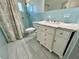 Updated bathroom with marble vanity and tiled shower at 2360 World Parkway Blvd # 54, Clearwater, FL 33763