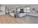 Open living area with hardwood floors and comfortable seating at 2919 W Elrod Ave, Tampa, FL 33611