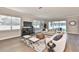 Living room features hardwood floors, neutral decor, and access to the backyard at 2919 W Elrod Ave, Tampa, FL 33611