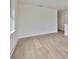 Bright bedroom with hardwood floors and large window at 2919 W Elrod Ave, Tampa, FL 33611