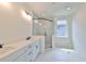 Modern bathroom with double vanity and large shower at 2919 W Elrod Ave, Tampa, FL 33611