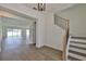 Light and airy entryway with staircase and view to living area at 2919 W Elrod Ave, Tampa, FL 33611