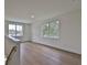 Spacious loft area with hardwood floors and large windows at 2919 W Elrod Ave, Tampa, FL 33611