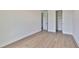 Well-lit bedroom with hardwood floors and closet at 2919 W Elrod Ave, Tampa, FL 33611