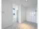 Condo entryway with tiled floors and kitchen peek at 4410 Fairways Blvd Blvd # 607, Bradenton, FL 34209