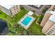 Community pool with surrounding patio and lawn at 4410 Fairways Blvd Blvd # 607, Bradenton, FL 34209