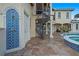Outdoor shower with blue tile and spiral staircase to upper level at 3341 Gulf Blvd, Belleair Beach, FL 33786