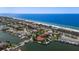 Expansive aerial view showcasing beachfront location at 3341 Gulf Blvd, Belleair Beach, FL 33786
