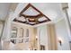 High ceiling foyer with chandelier and decorative columns at 3341 Gulf Blvd, Belleair Beach, FL 33786