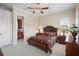 Bedroom with a queen bed, ensuite bathroom access, and plenty of natural light at 3341 Gulf Blvd, Belleair Beach, FL 33786